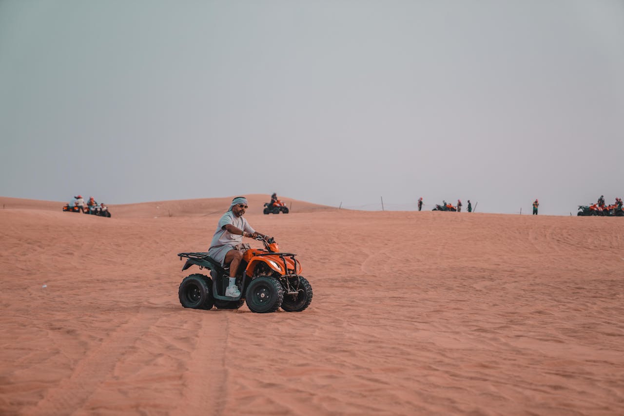 Experience the thrill of quad biking across vast desert dunes, perfect for adventure seekers.